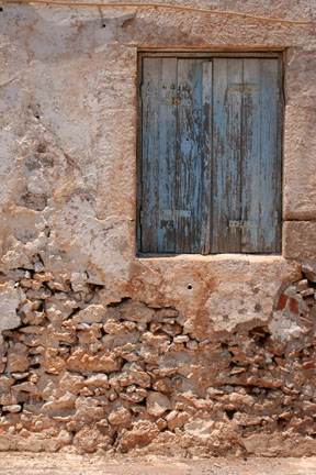 Blue shutters on a stone house.