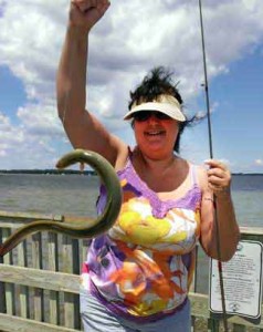 Kelly A. Harmon and an Eel she caught.